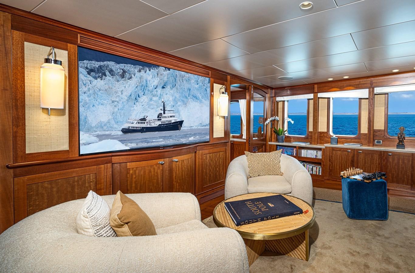 a living room with a large mirror aboard ASTERIA Yacht for Charter