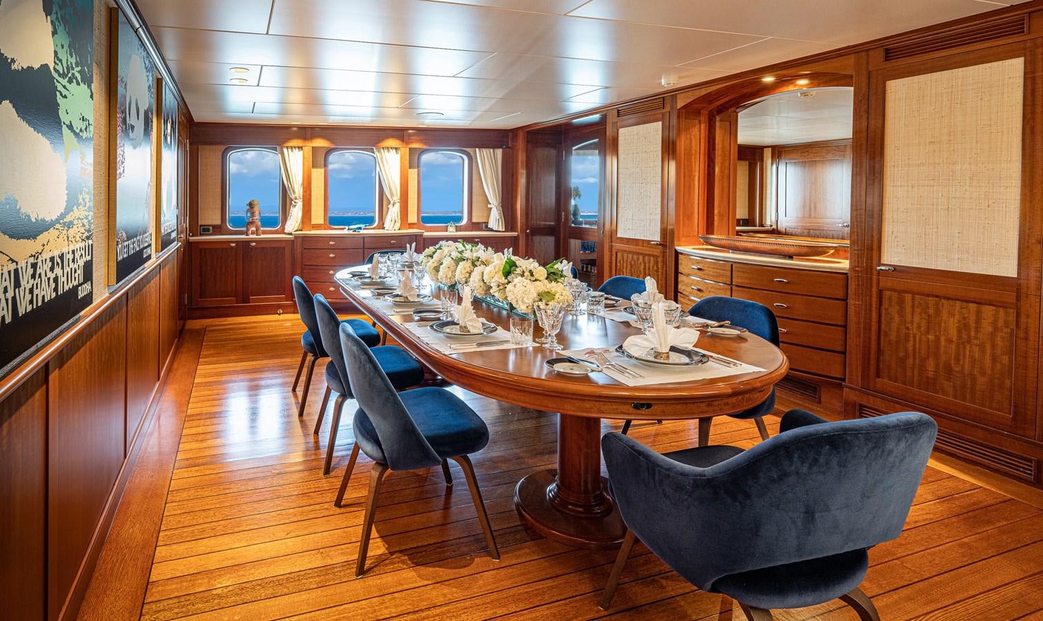a large kitchen with a table and chairs aboard ASTERIA Yacht for Charter
