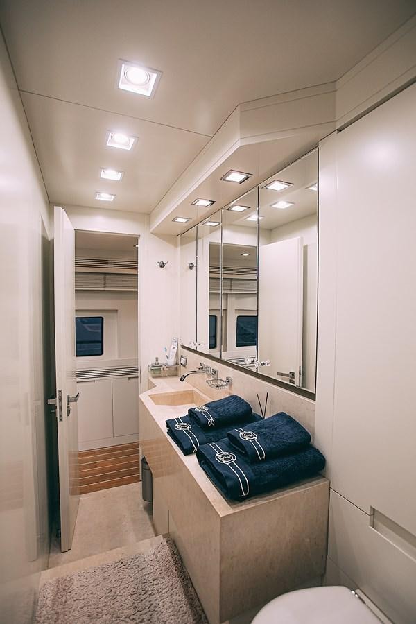 a bathroom with a large mirror aboard KALISA Yacht for Sale