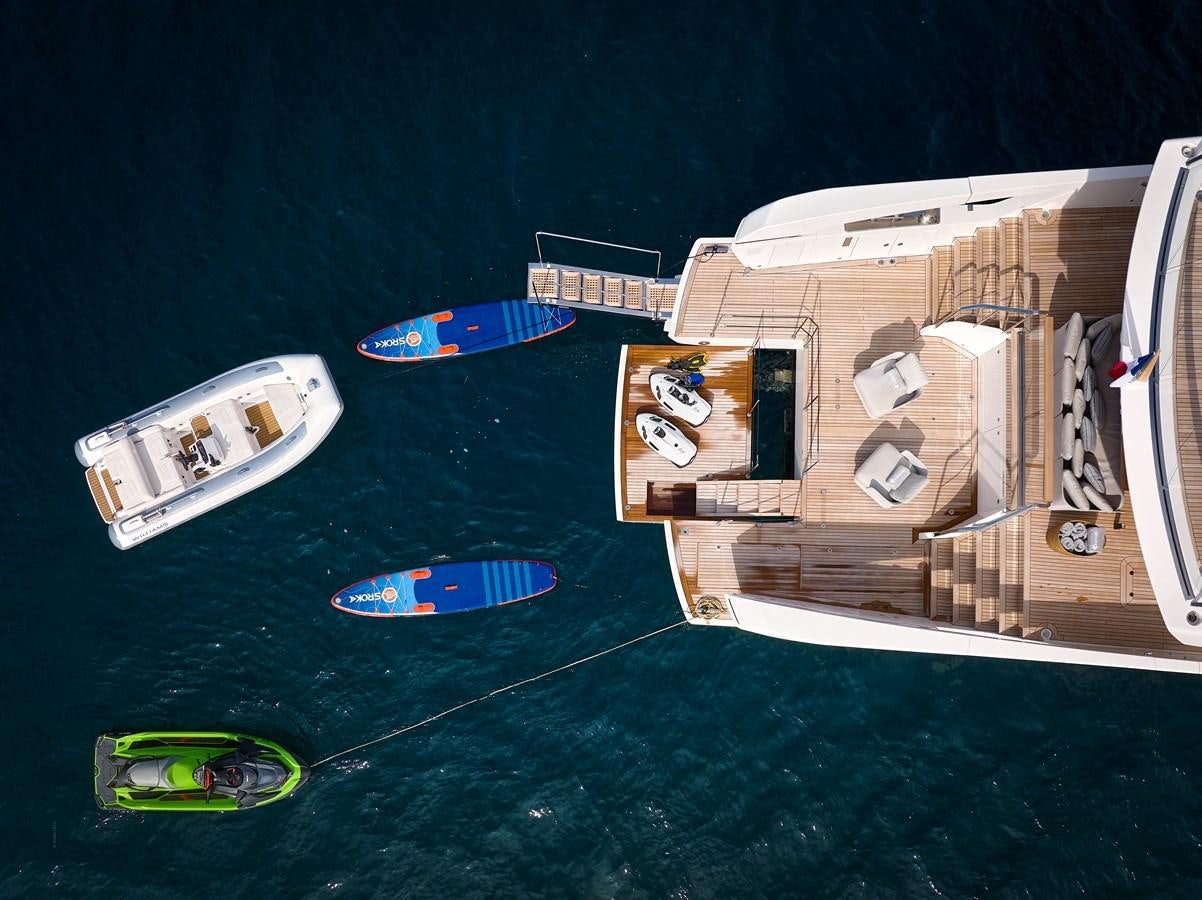 a group of boats on a body of water aboard OCEAN 6 Yacht for Sale