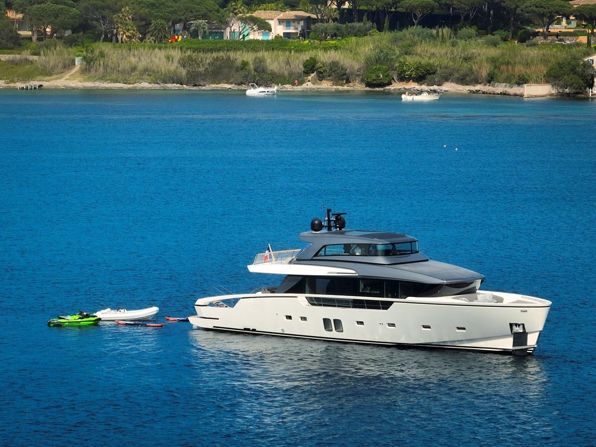 a white boat on the water aboard OCEAN 6 Yacht for Sale