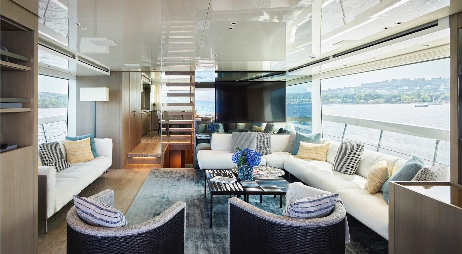 a living room with a staircase aboard OCEAN 6 Yacht for Sale