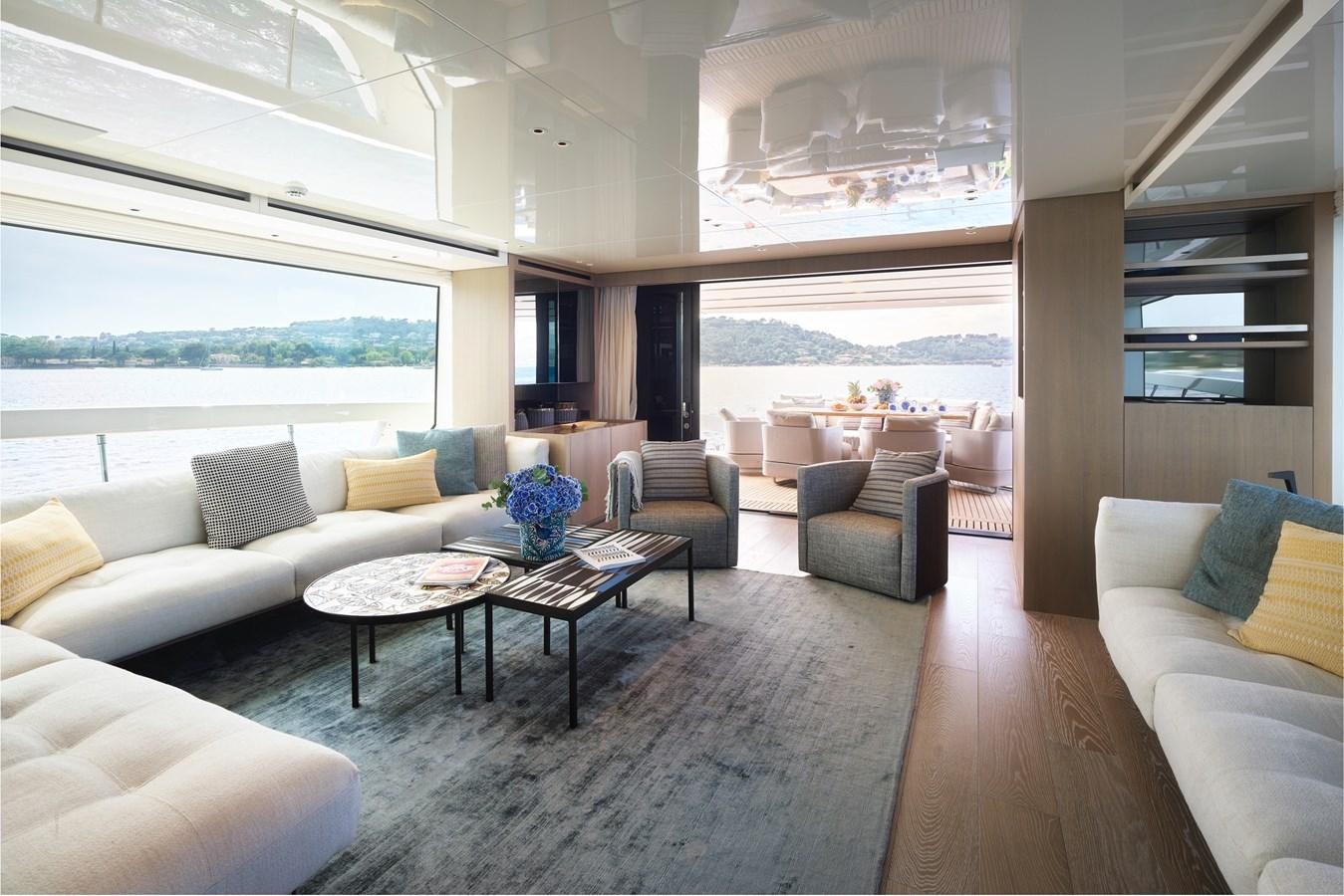 a living room with a large window aboard OCEAN 6 Yacht for Sale