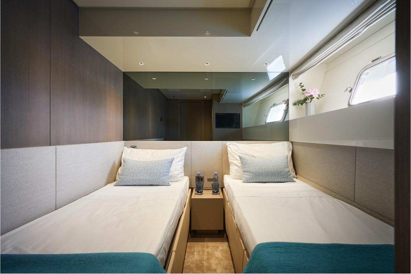 a room with two beds aboard OCEAN 6 Yacht for Sale