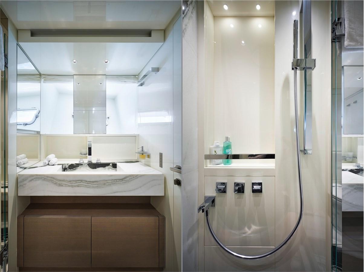 a bathroom with a sink and a shower aboard OCEAN 6 Yacht for Sale
