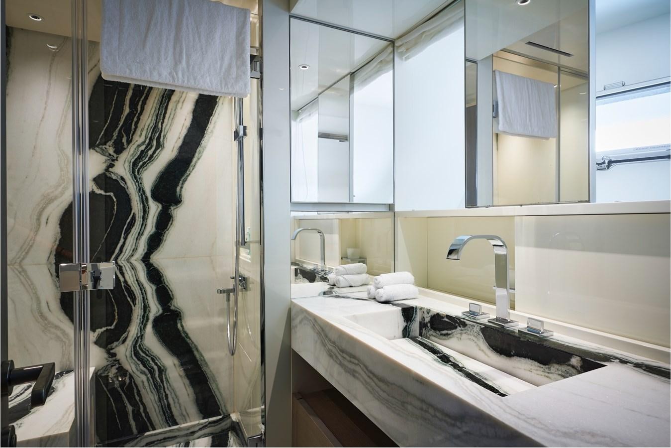 a bathroom with a sink and a mirror aboard OCEAN 6 Yacht for Sale