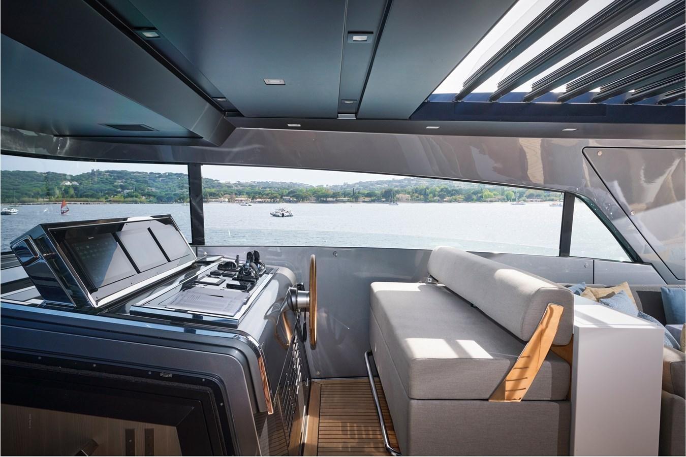 a car with a table and chairs aboard OCEAN 6 Yacht for Sale