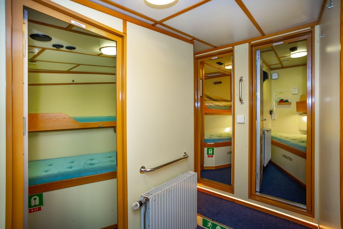 a bathroom with a blue and yellow shower unit aboard ASTRA Yacht for Sale