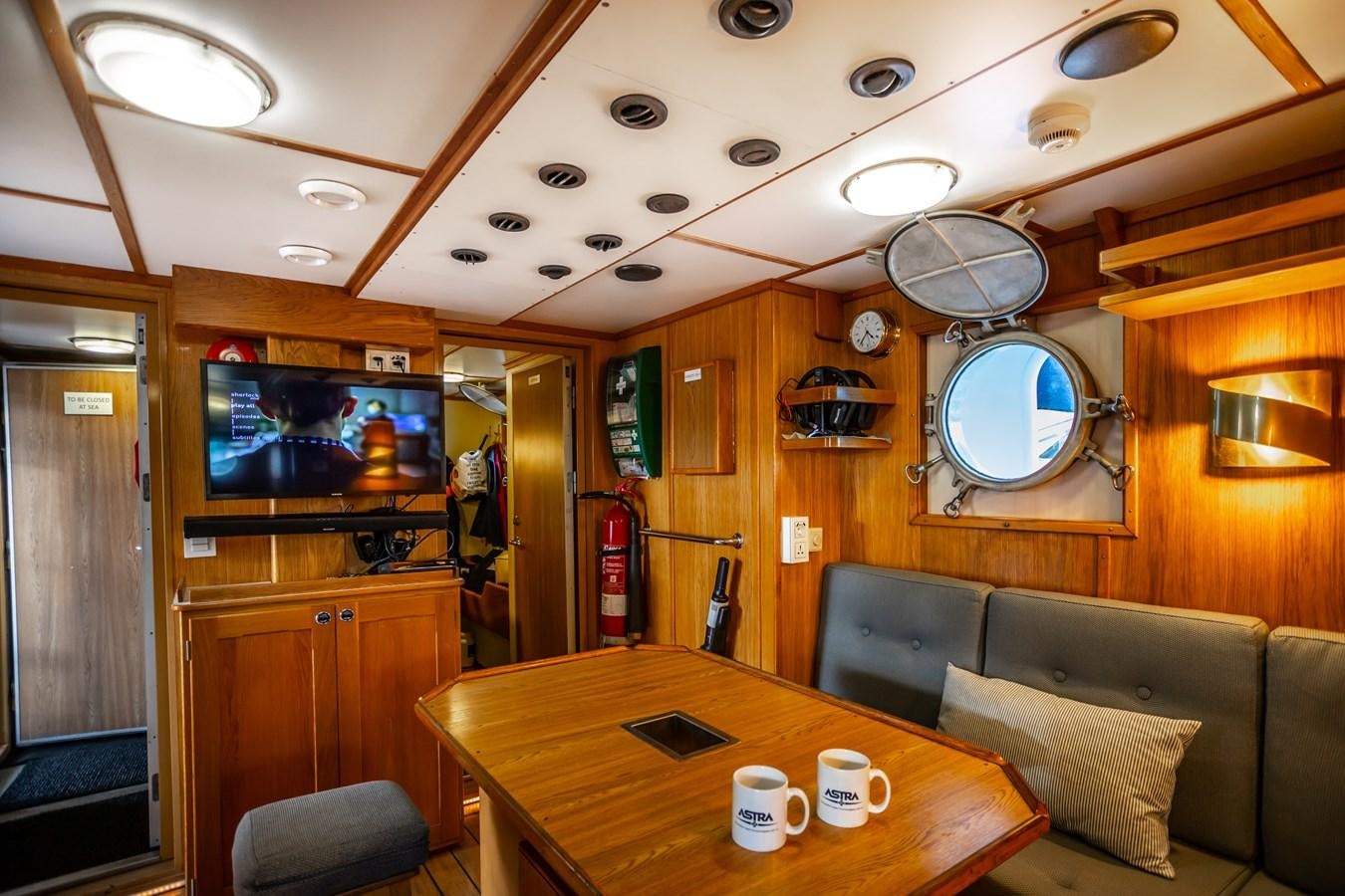 a room with a table and chairs aboard ASTRA Yacht for Sale
