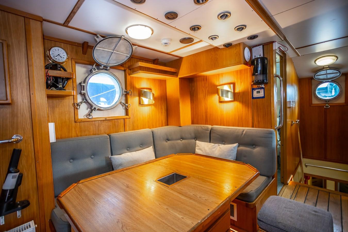 a living room with a leather couch aboard ASTRA Yacht for Sale