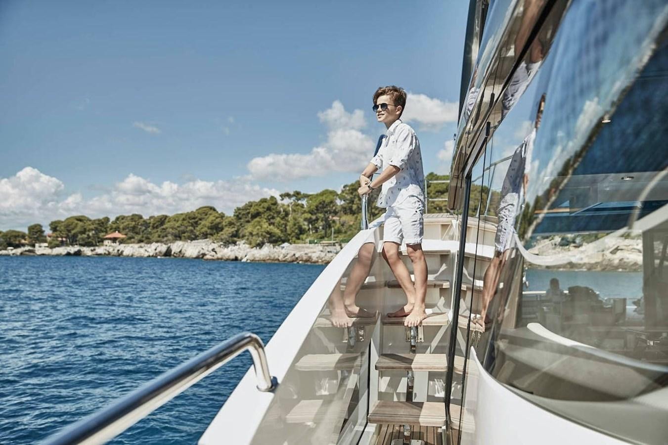a boy on a boat aboard ROCKSTAR Yacht for Sale