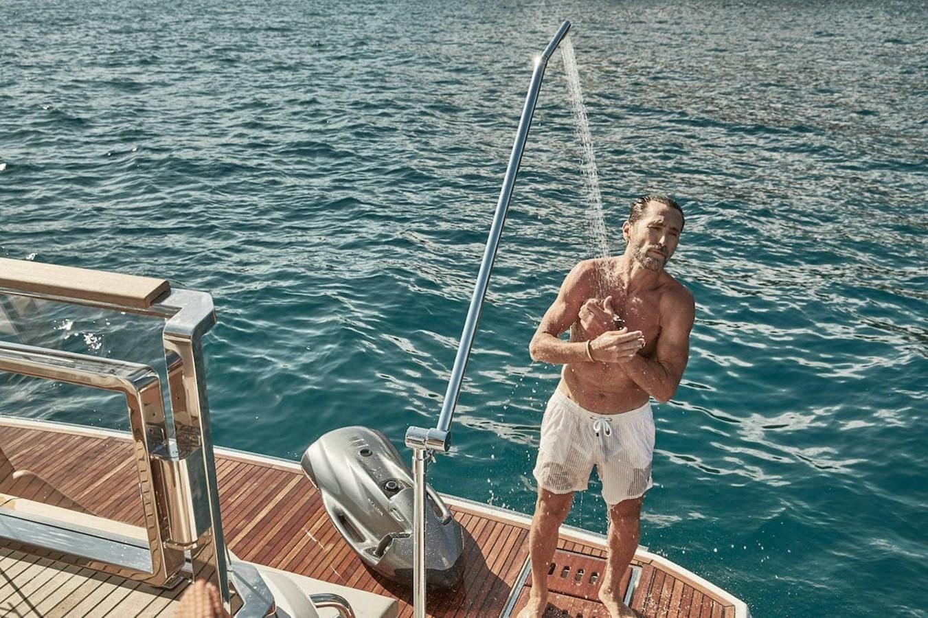 a person standing on a boat aboard ROCKSTAR Yacht for Sale