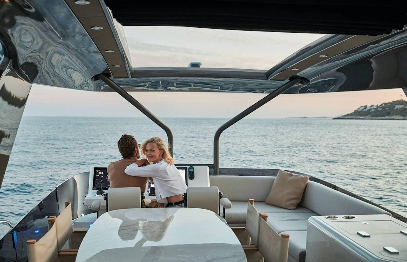 a couple sitting on a boat aboard ROCKSTAR Yacht for Sale