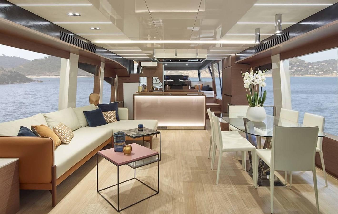 a living room with a couch and a table aboard ROCKSTAR Yacht for Sale