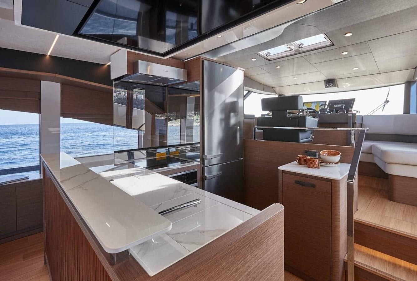 a modern kitchen with a large glass window aboard ROCKSTAR Yacht for Sale