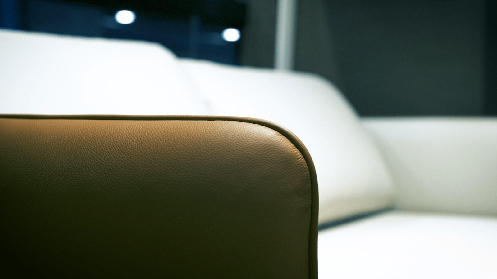 a leather chair in a room aboard ROCKSTAR Yacht for Sale