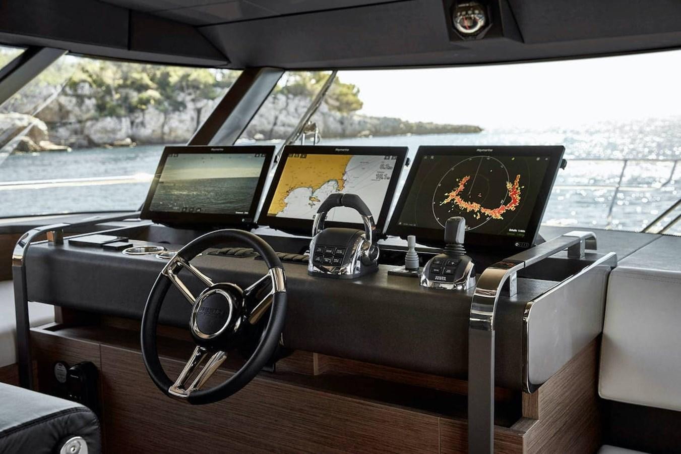 a table with laptops and electronic devices on it aboard ROCKSTAR Yacht for Sale