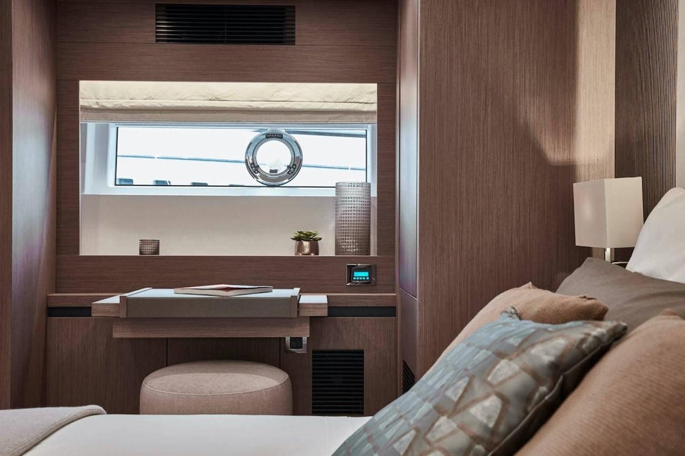 a room with a bed and a mirror aboard ROCKSTAR Yacht for Sale