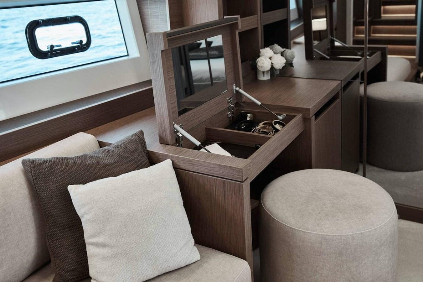 a living room with a fireplace aboard ROCKSTAR Yacht for Sale