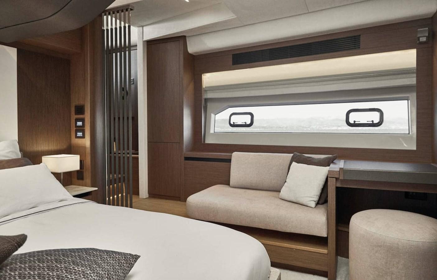 a room with a bed and a couch aboard ROCKSTAR Yacht for Sale