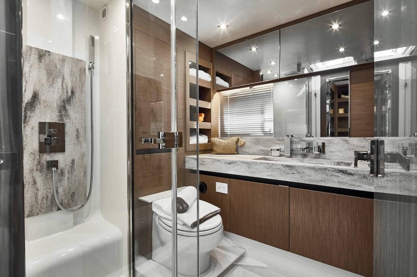 a bathroom with a glass shower aboard ROCKSTAR Yacht for Sale