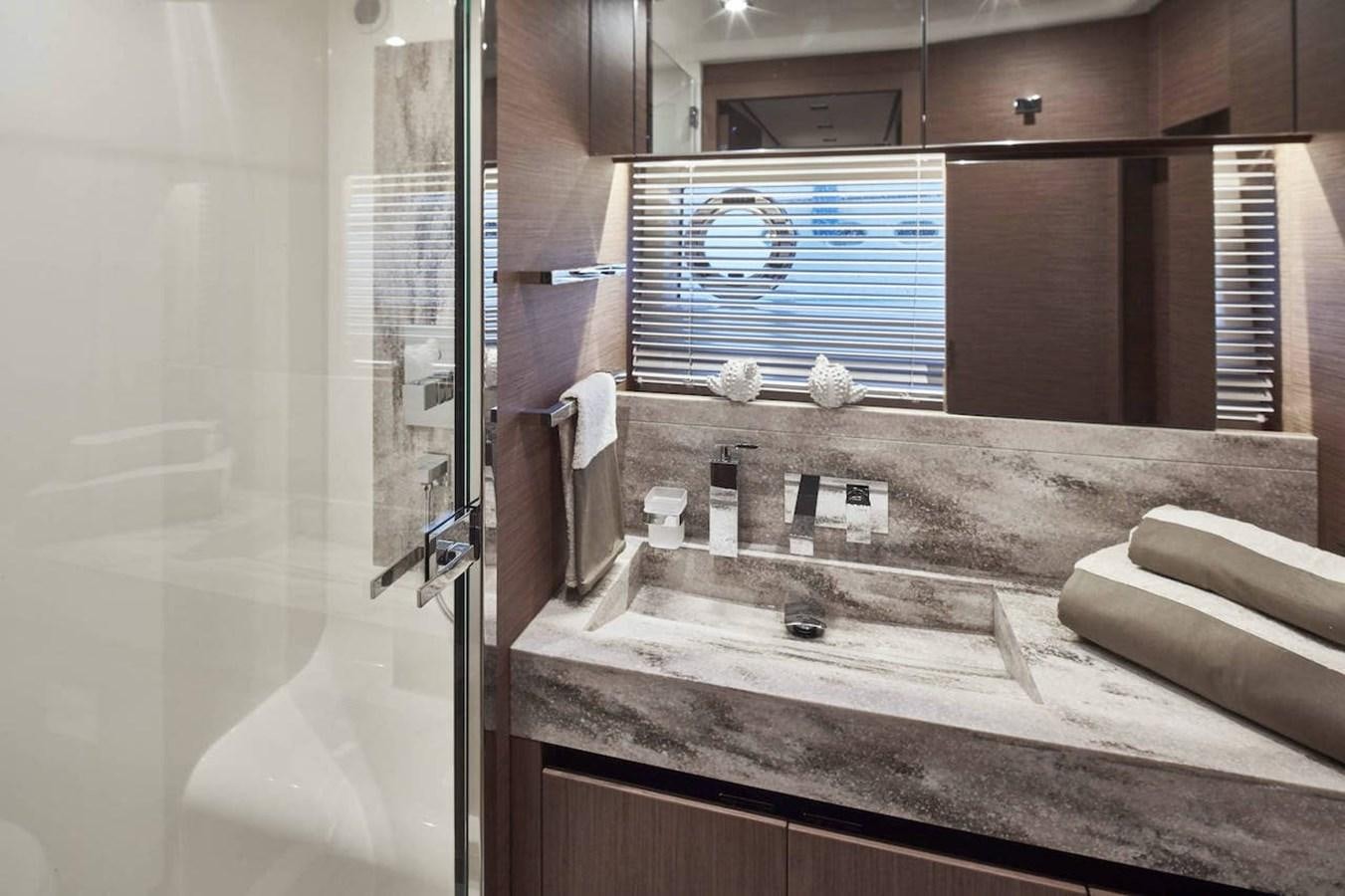 a bathroom with a large mirror aboard ROCKSTAR Yacht for Sale