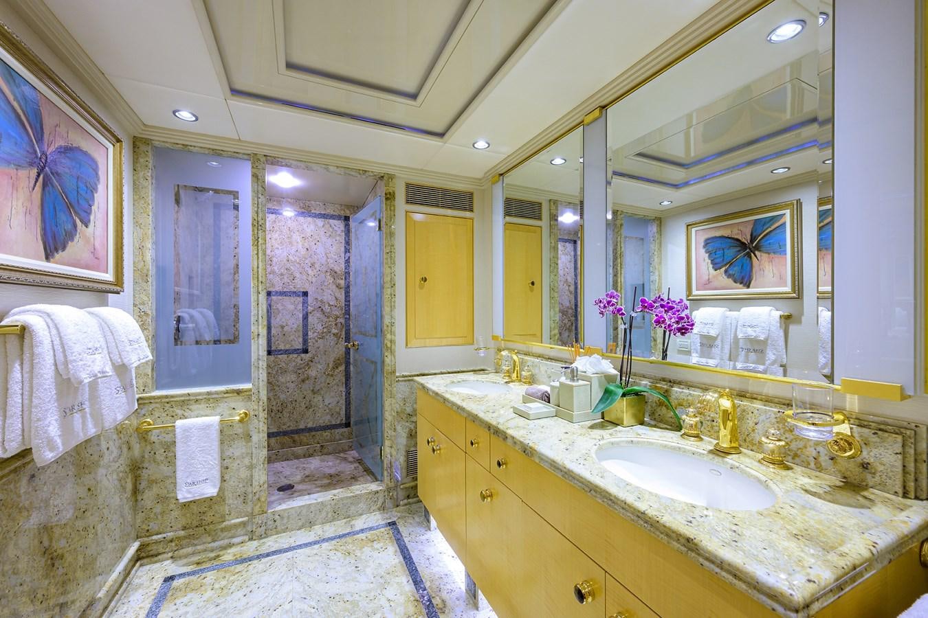 a bathroom with a large mirror aboard STARSHIP Yacht for Charter