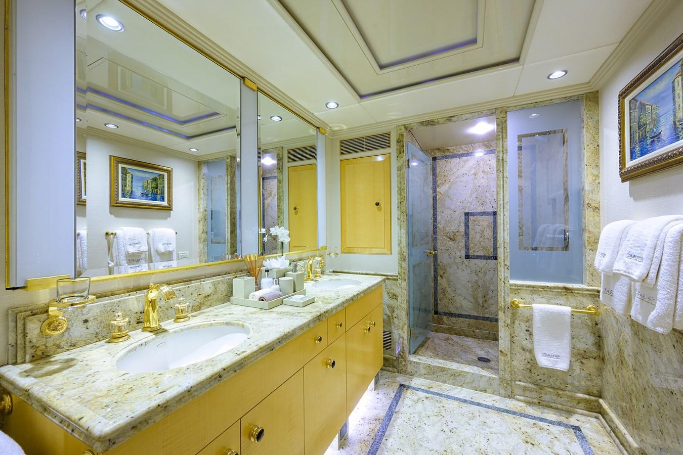 a bathroom with a large mirror aboard STARSHIP Yacht for Charter