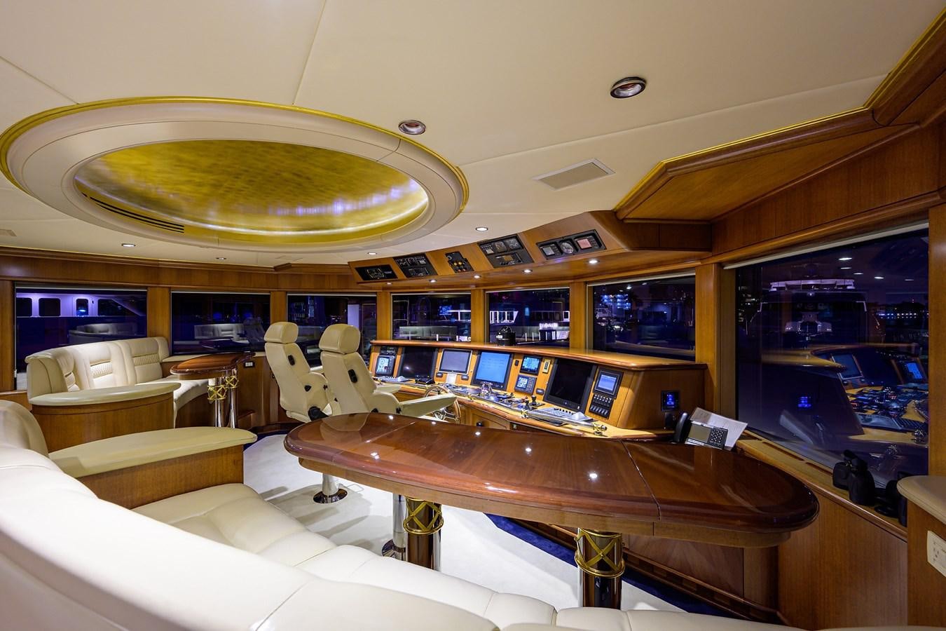 a room with a table and chairs aboard STARSHIP Yacht for Charter
