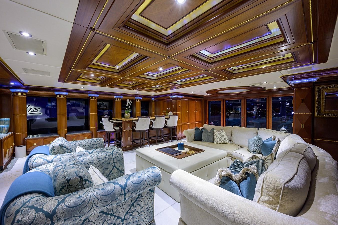 a living room with a large window aboard STARSHIP Yacht for Charter