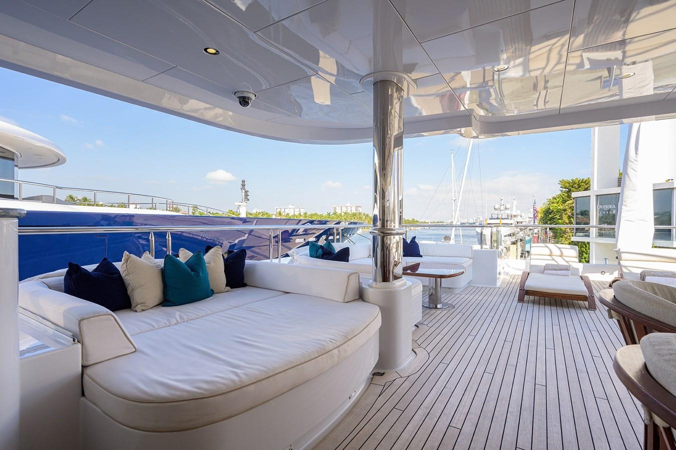 a room with a view of the ocean and a large patio aboard STARSHIP Yacht for Charter
