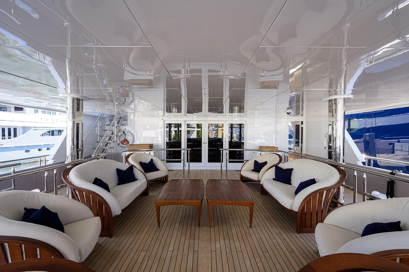 a large living room with a wood floor aboard STARSHIP Yacht for Charter