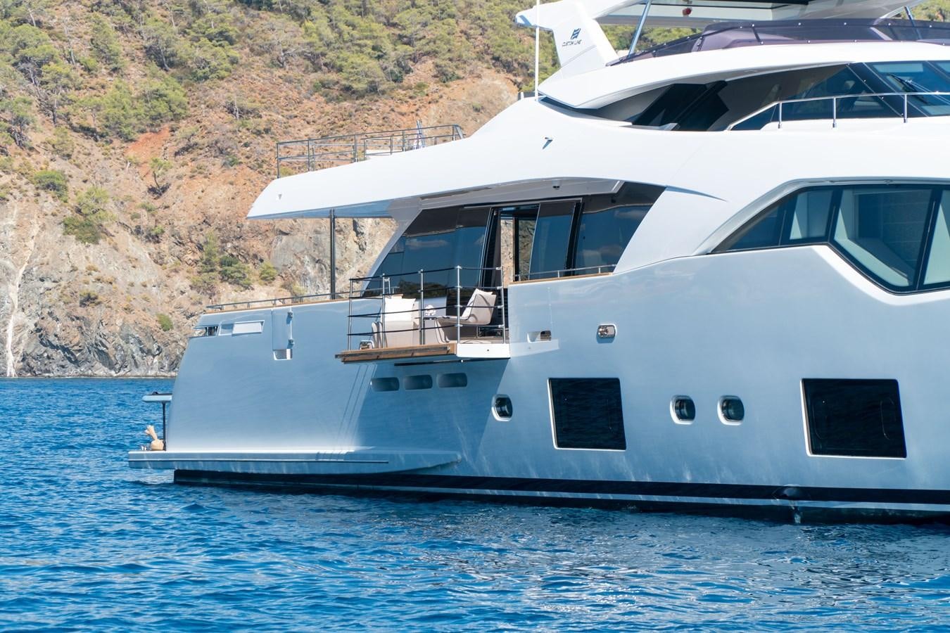 a white yacht on the water aboard ARES Yacht for Sale