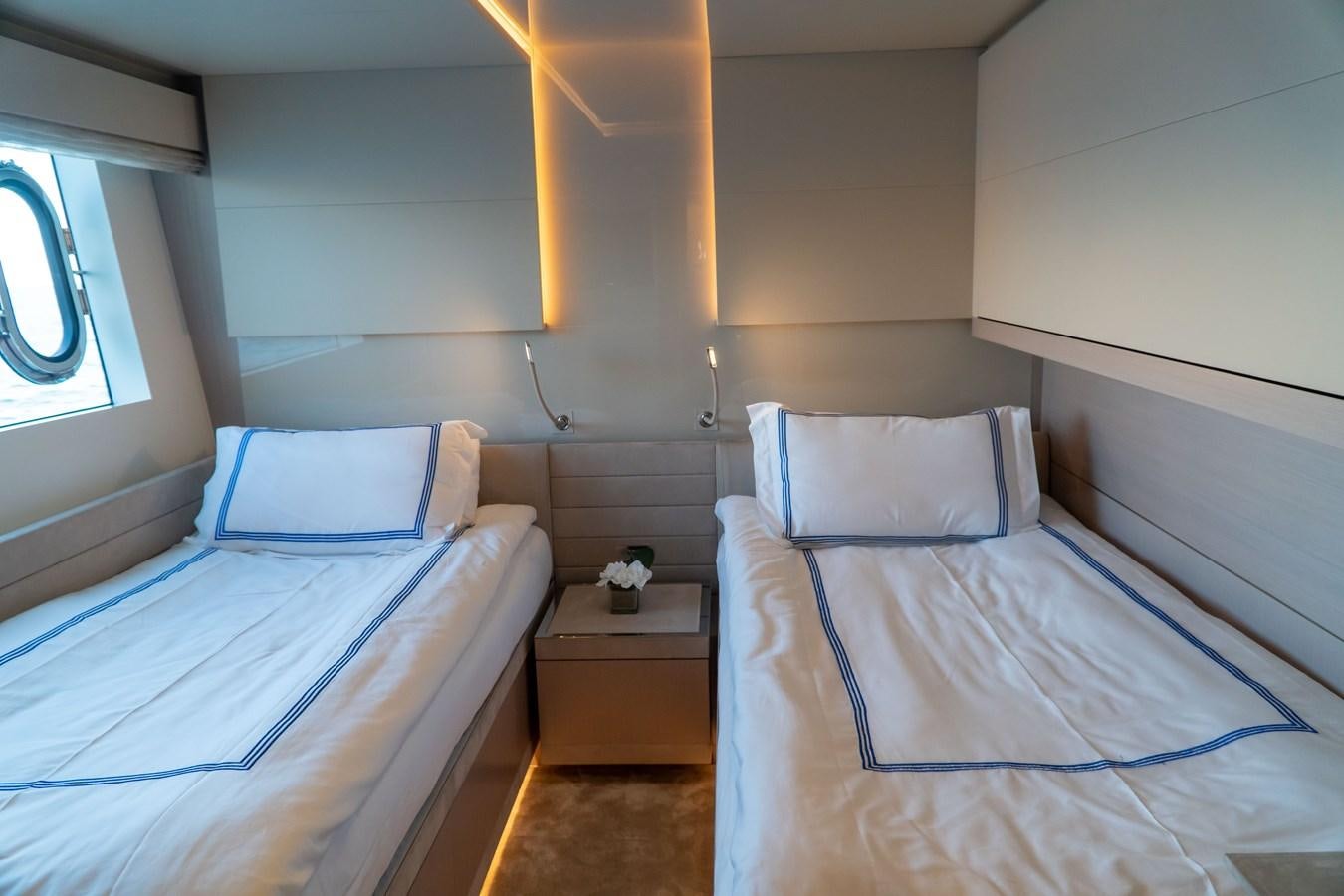 a couple of beds in a room aboard ARES Yacht for Sale