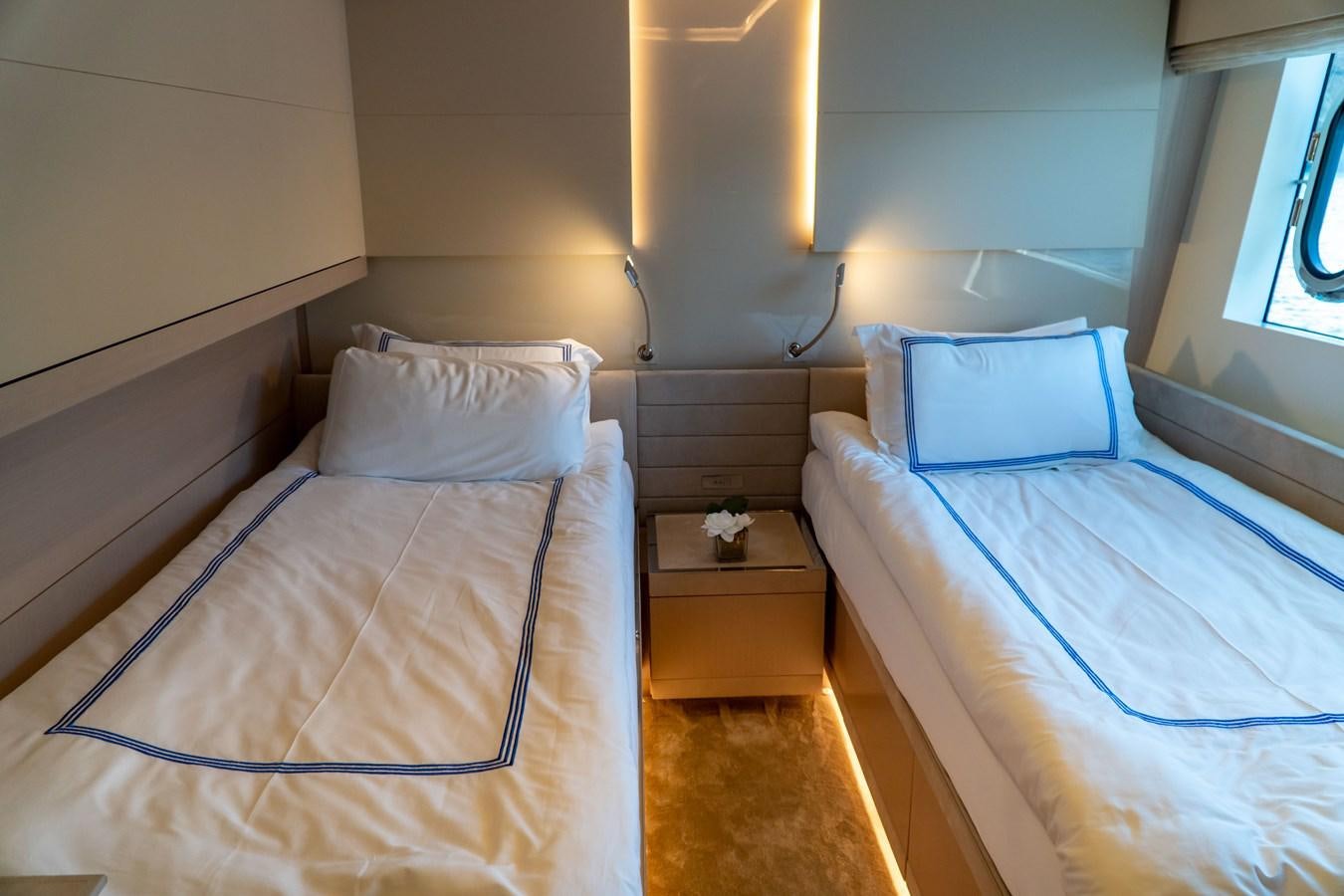 a couple of beds in a room aboard ARES Yacht for Sale