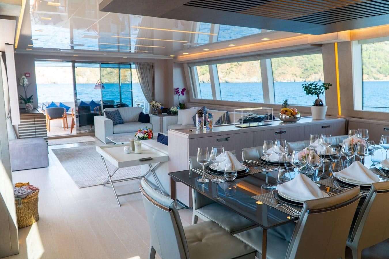 a large kitchen with a large dining table aboard ARES Yacht for Sale