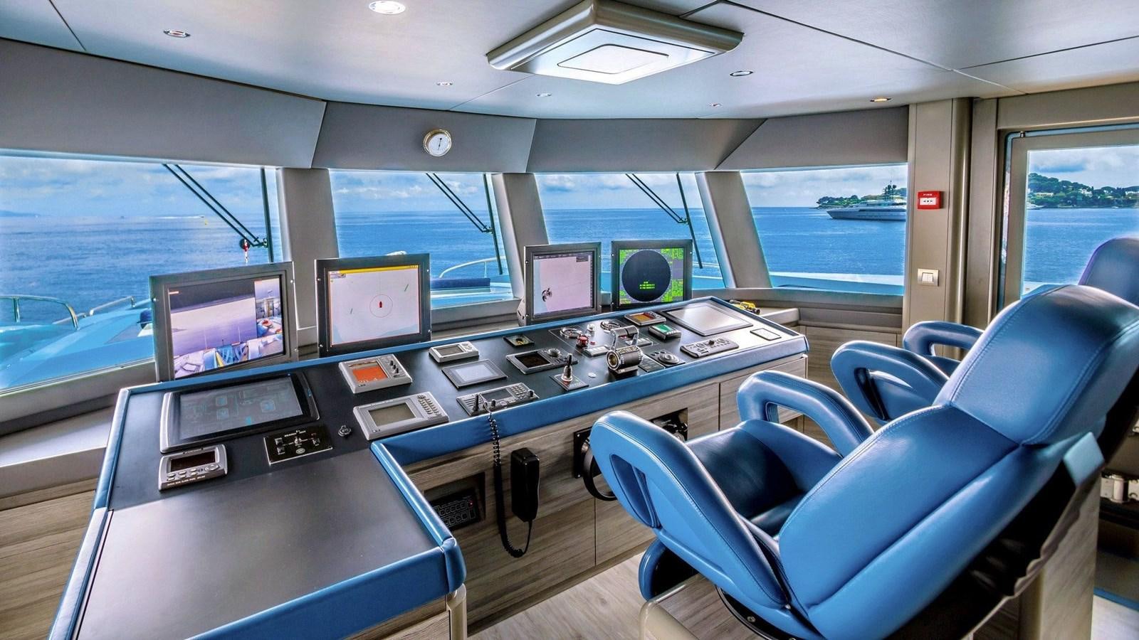 a room with a desk and computers aboard QUEEN ALLA Yacht for Sale
