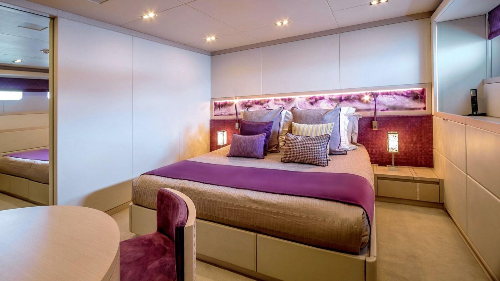 a bed in a room aboard QUEEN ALLA Yacht for Sale