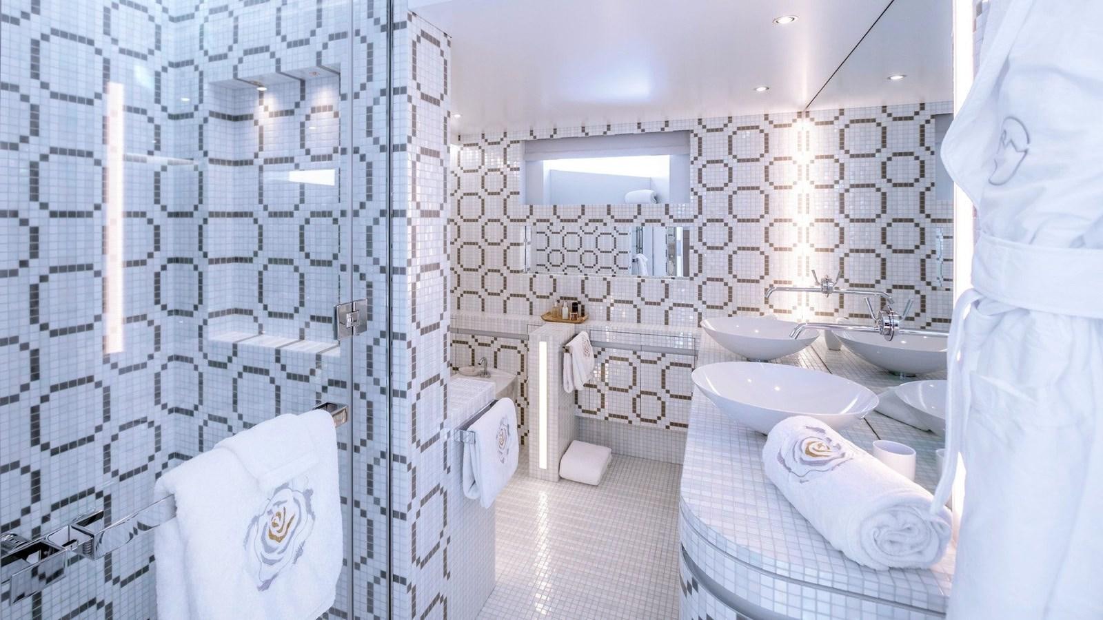 a bathroom with a white shower curtain aboard QUEEN ALLA Yacht for Sale