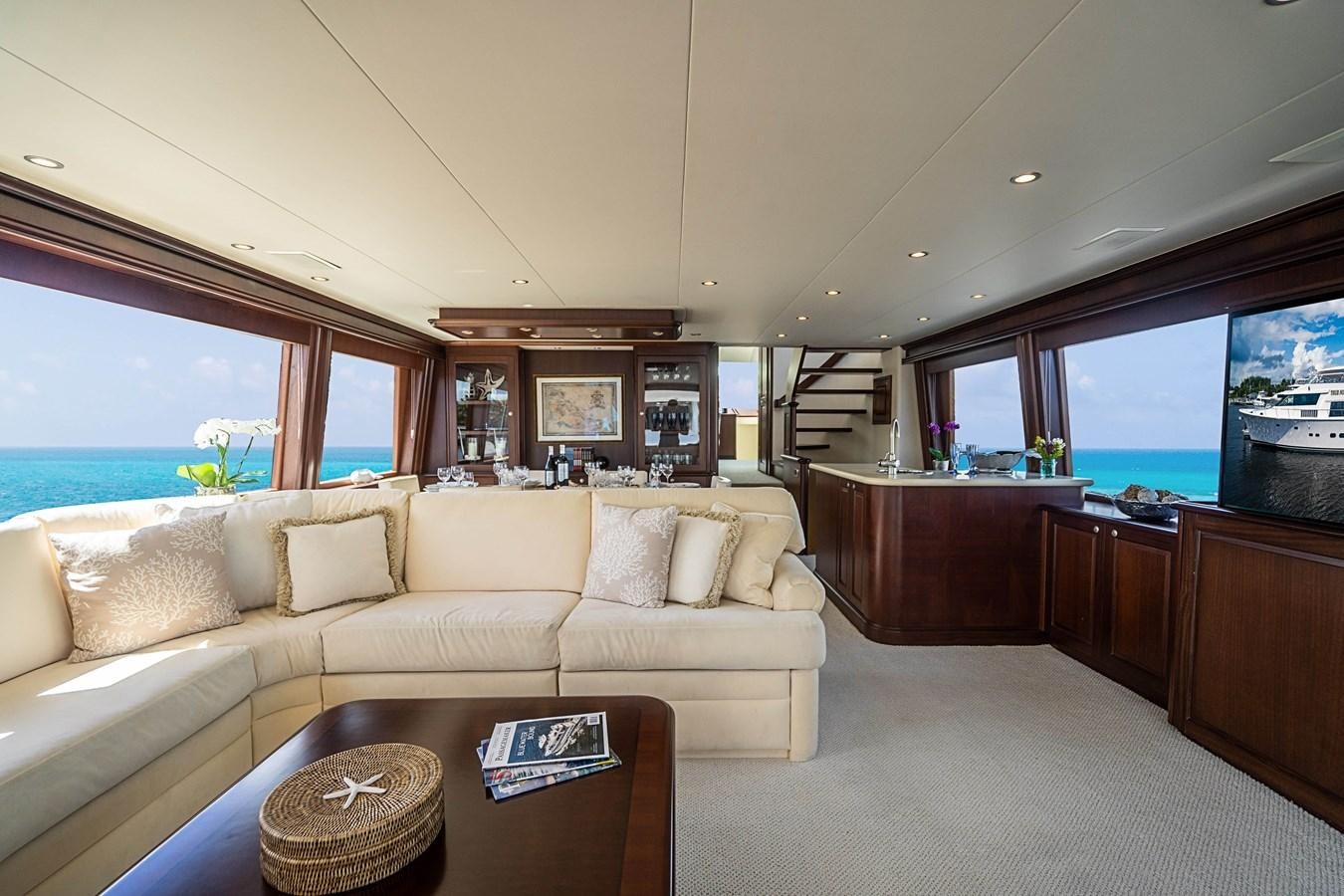 a living room with a couch and a coffee table aboard TRUE NORTH Yacht for Sale