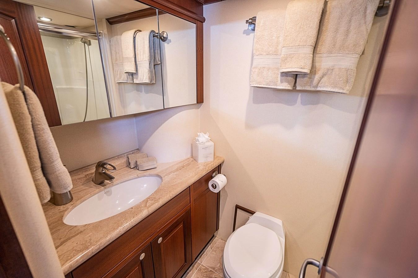 a bathroom with a sink and toilet aboard TRUE NORTH Yacht for Sale