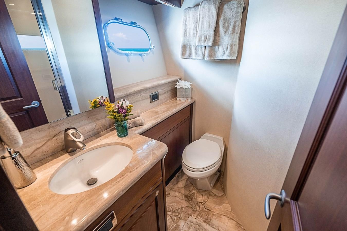 a bathroom with a sink and a toilet aboard TRUE NORTH Yacht for Sale