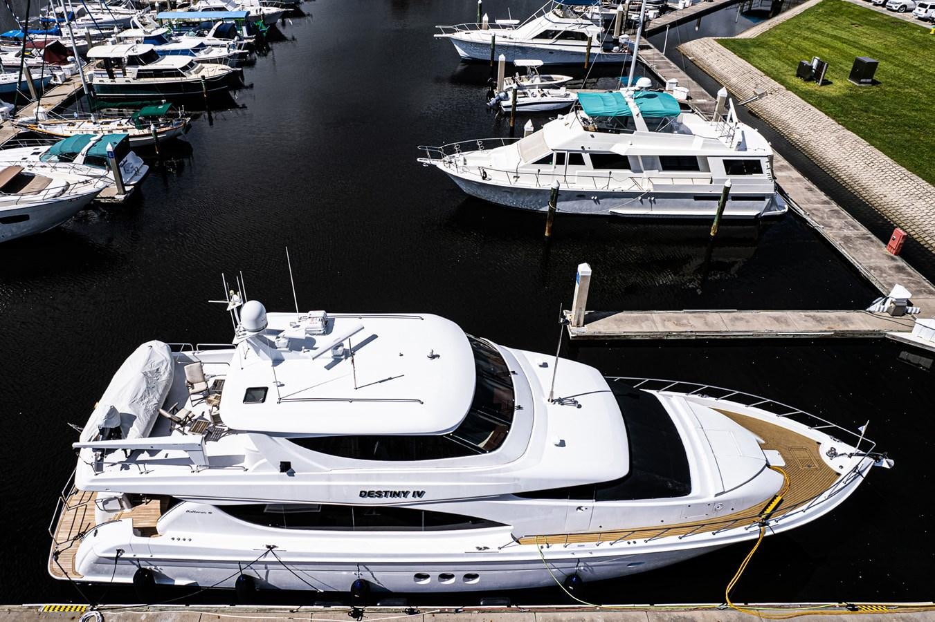 a group of boats sit in a harbor aboard DESTINI IV Yacht for Sale