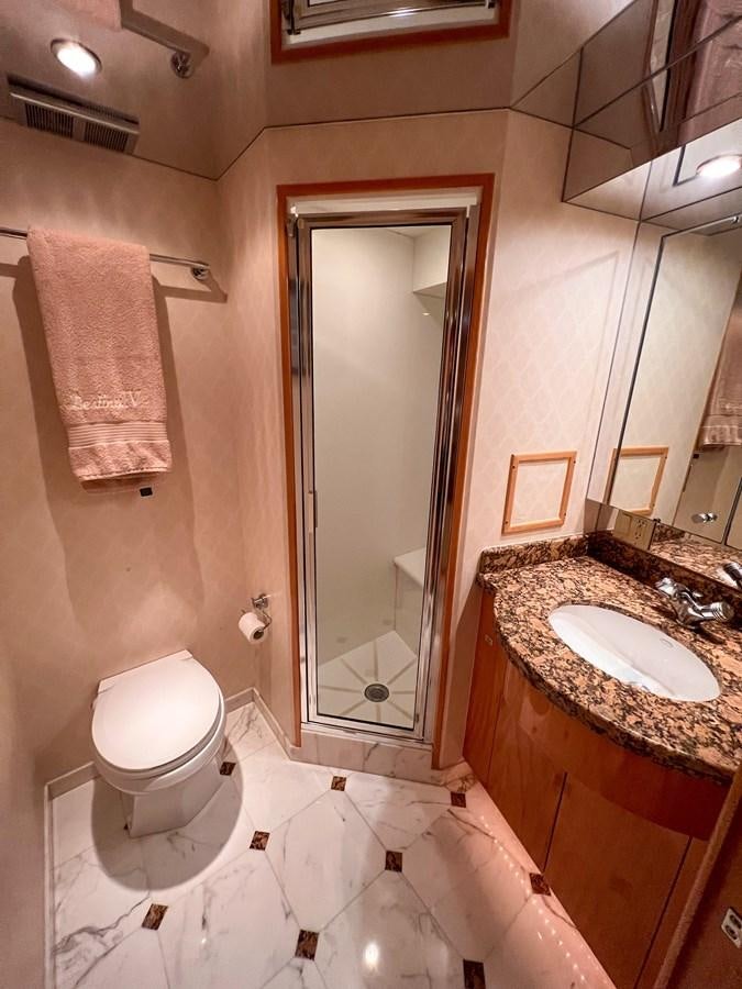 a bathroom with a sink and a toilet aboard DESTINI IV Yacht for Sale
