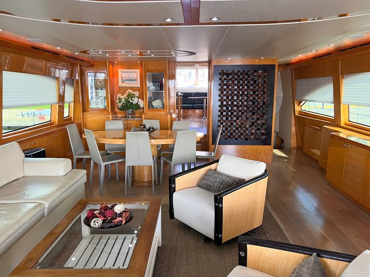 a living room with a couch and a table aboard DESTINI IV Yacht for Sale