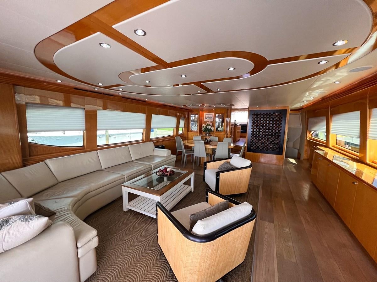 a living room with a wood floor aboard DESTINI IV Yacht for Sale