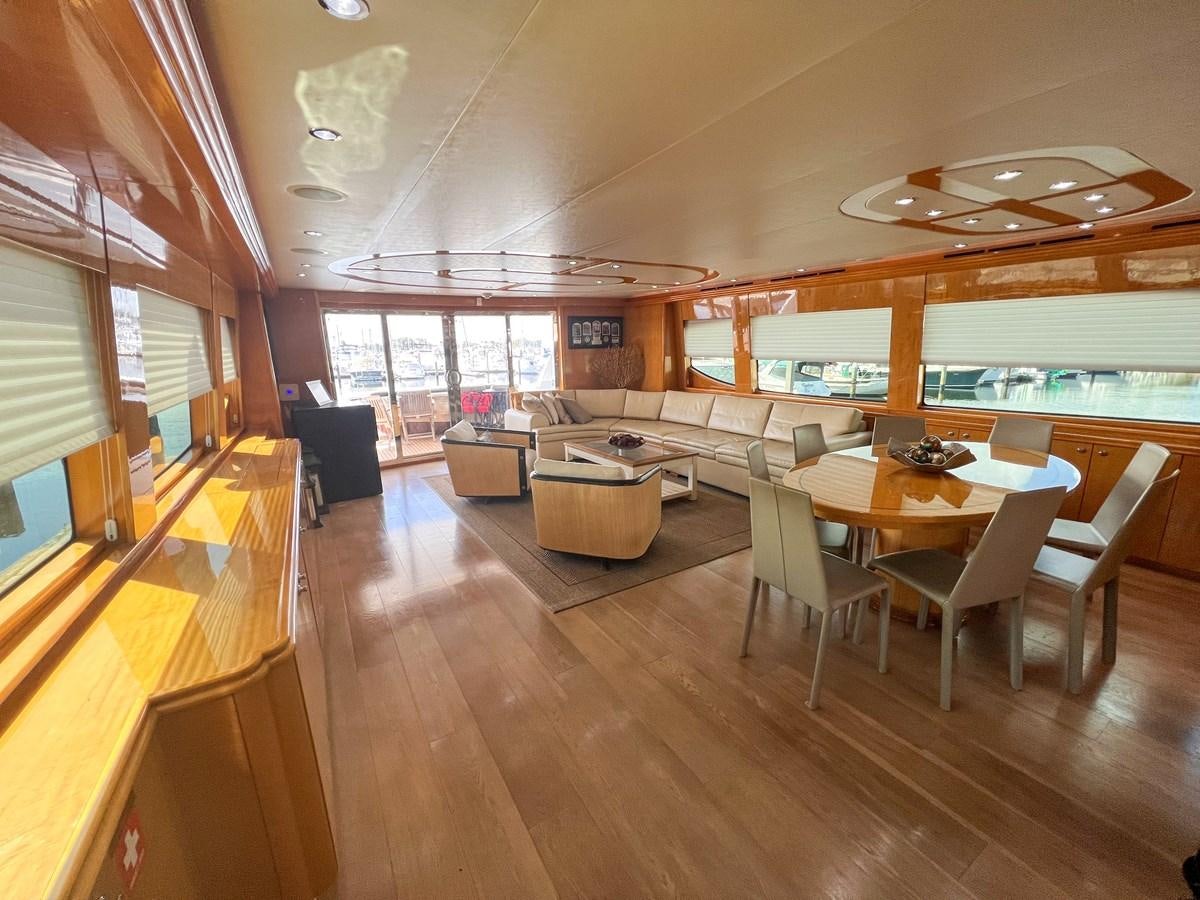 a living room with a wood floor aboard DESTINI IV Yacht for Sale