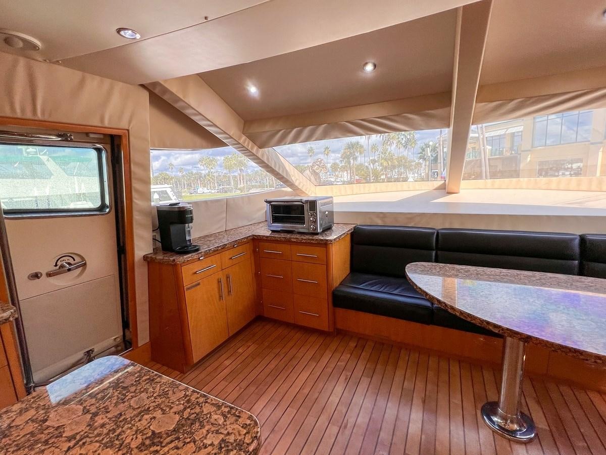a living room with a couch and a tv aboard DESTINI IV Yacht for Sale