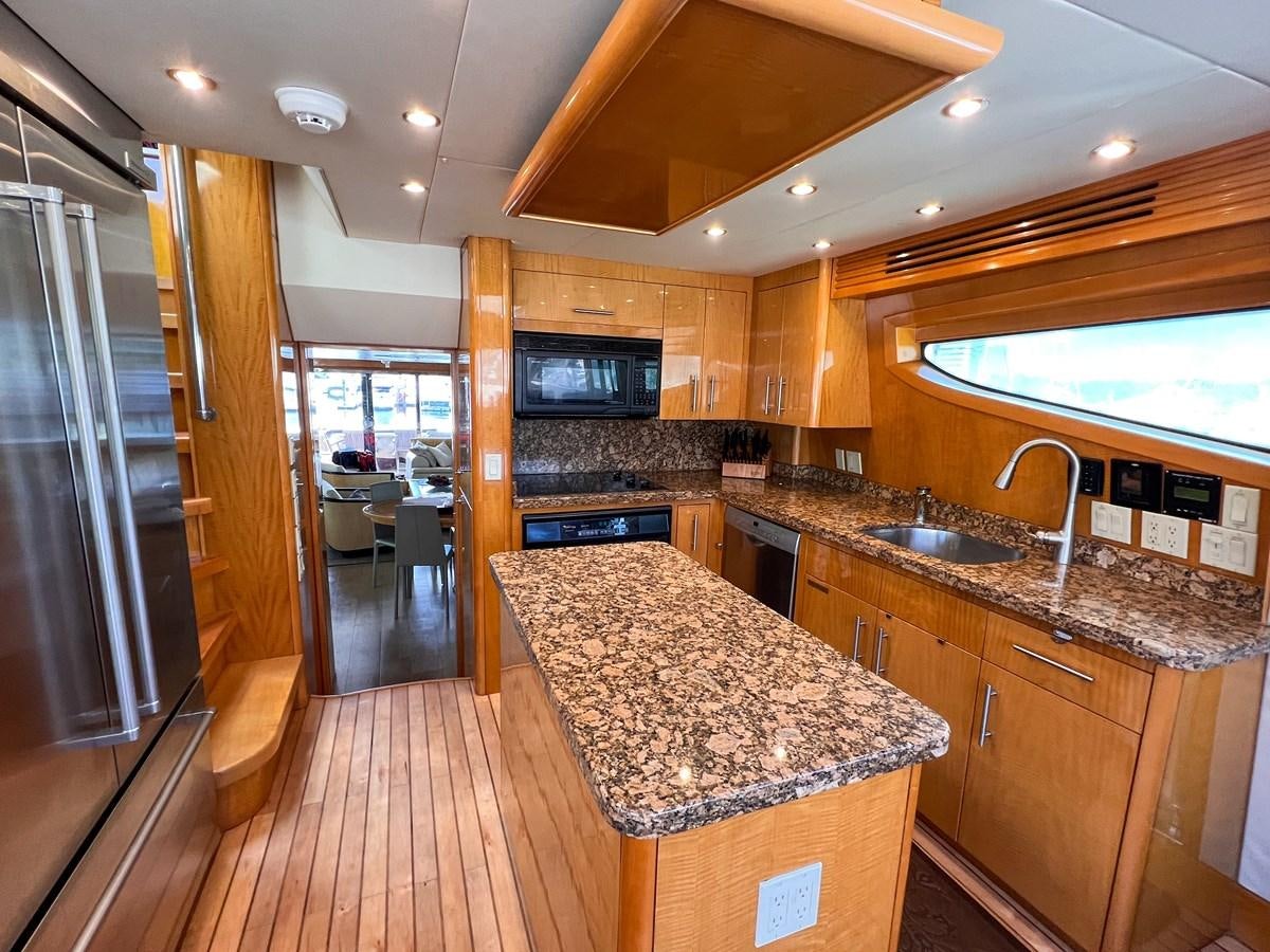 a kitchen with a large island aboard DESTINI IV Yacht for Sale