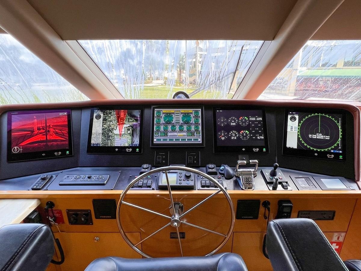a control panel with monitors and monitors aboard DESTINI IV Yacht for Sale
